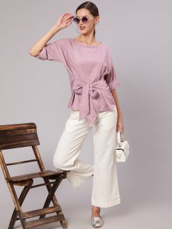 A Mauve Color Self Weaved Embellished Top With Cotton White Flared Pants.