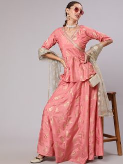 A Peach Color Printed Silk Blend Peplum Top And Skirt With Net Dupatta